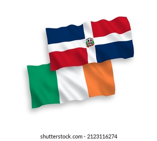 National vector fabric wave flags of Ireland and Dominican Republic isolated on white background. 1 to 2 proportion.
