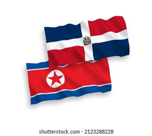 Banderas de olas de tela vectorial nacional de Corea del Norte y República Dominicana aisladas en fondo blanco. de 1 a 2.