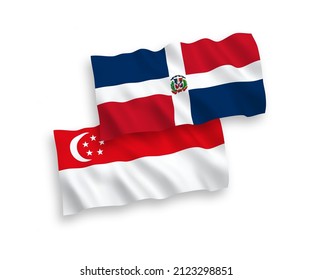 Banderas de olas de tela vectorial nacional de la República Dominicana y Singapur aisladas en fondo blanco. de 1 a 2.