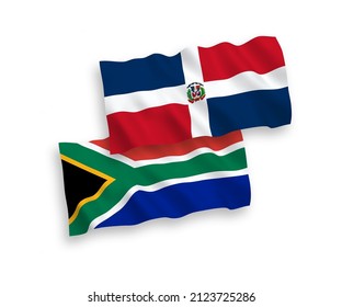 Banderas de olas de tela vectorial nacional de la República Dominicana y la República de Sudáfrica aisladas en fondo blanco. de 1 a 2.