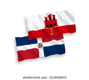 National vector fabric wave flags of Dominican Republic and Gibraltar isolated on white background. 1 to 2 proportion.