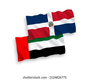 National vector fabric wave flags of Dominican Republic and United Arab Emirates isolated on white background. 1 to 2 proportion.