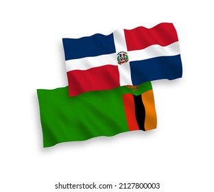 National vector fabric wave flags of Dominican Republic and Republic of Zambia isolated on white background. 1 to 2 proportion.