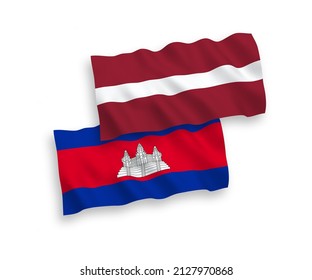 National vector fabric wave flags of Latvia and Kingdom of Cambodia isolated on white background. 1 to 2 proportion.