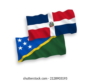 National vector fabric wave flags of Dominican Republic and Solomon Islands isolated on white background. 1 to 2 proportion.