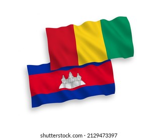 National vector fabric wave flags of Kingdom of Cambodia and Guinea isolated on white background. 1 to 2 proportion.