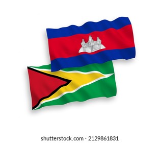 National vector fabric wave flags of Kingdom of Cambodia and Co-operative Republic of Guyana isolated on white background. 1 to 2 proportion.