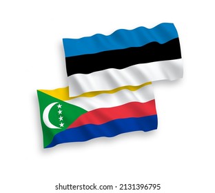 National vector fabric wave flags of Estonia and Union of the Comoros isolated on white background. 1 to 2 proportion.