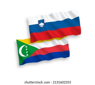 National vector fabric wave flags of Slovenia and Union of the Comoros isolated on white background. 1 to 2 proportion.