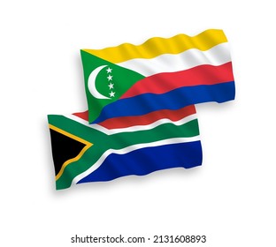 National vector fabric wave flags of Union of the Comoros and Republic of South Africa isolated on white background. 1 to 2 proportion.