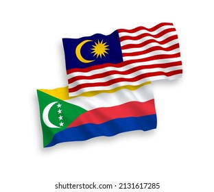 Banderas de olas de tela vectorial nacional de la Unión de las Comoras y Malasia aisladas en fondo blanco. de 1 a 2.