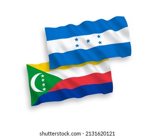 National vector fabric wave flags of Union of the Comoros and Honduras isolated on white background. 1 to 2 proportion.