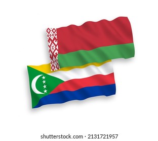 National vector fabric wave flags of Union of the Comoros and Belarus isolated on white background. 1 to 2 proportion.