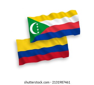 National vector fabric wave flags of Union of the Comoros and Colombia isolated on white background. 1 to 2 proportion.