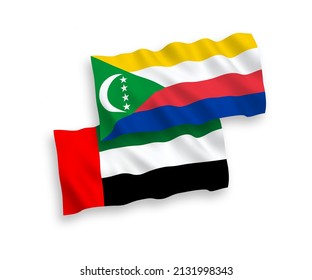 National vector fabric wave flags of Union of the Comoros and United Arab Emirates isolated on white background. 1 to 2 proportion.