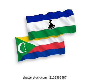 National vector fabric wave flags of Union of the Comoros and Lesotho isolated on white background. 1 to 2 proportion.