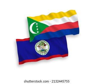 National vector fabric wave flags of Union of the Comoros and Belize isolated on white background. 1 to 2 proportion.
