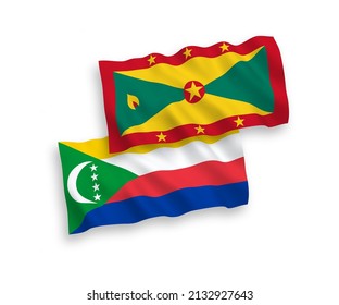 National vector fabric wave flags of Union of the Comoros and Grenada isolated on white background. 1 to 2 proportion.