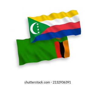 National vector fabric wave flags of Union of the Comoros and Republic of Zambia isolated on white background. 1 to 2 proportion.