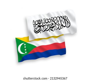 National vector fabric wave flags of Union of the Comoros and Islamic Emirate of Afghanistan isolated on white background. 1 to 2 proportion.