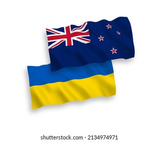 National vector fabric wave flags of New Zealand and Ukraine isolated on white background. 1 to 2 proportion.