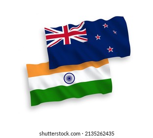 National vector fabric wave flags of India and New Zealand isolated on white background. 1 to 2 proportion.