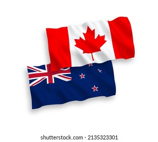 National vector fabric wave flags of Canada and New Zealand isolated on white background. 1 to 2 proportion.