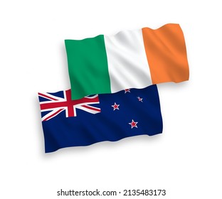 National vector fabric wave flags of Ireland and New Zealand isolated on white background. 1 to 2 proportion.