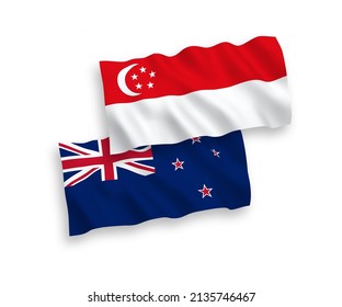 National vector fabric wave flags of New Zealand and Singapore isolated on white background. 1 to 2 proportion.