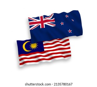 National vector fabric wave flags of New Zealand and Malaysia isolated on white background. 1 to 2 proportion.