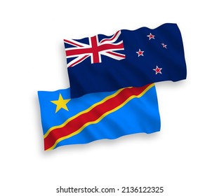 National vector fabric wave flags of New Zealand and Democratic Republic of the Congo isolated on white background. 1 to 2 proportion.