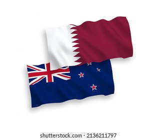 National vector fabric wave flags of New Zealand and Qatar isolated on white background. 1 to 2 proportion.