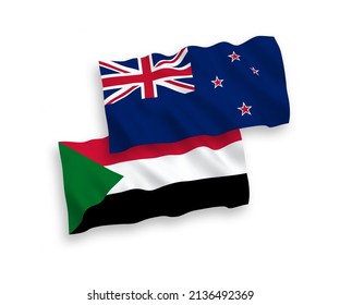 National vector fabric wave flags of New Zealand and Sudan isolated on white background. 1 to 2 proportion.