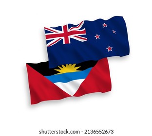 Banderas de ondulación de tela vectorial nacional de Nueva Zelandia y Antigua y Barbuda aisladas de fondo blanco. de 1 a 2.