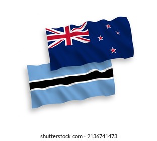National vector fabric wave flags of New Zealand and Botswana isolated on white background. 1 to 2 proportion.