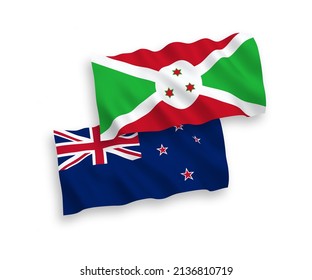 National vector fabric wave flags of New Zealand and Burundi isolated on white background. 1 to 2 proportion.