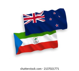 National vector fabric wave flags of New Zealand and Republic of Equatorial Guinea isolated on white background. 1 to 2 proportion.