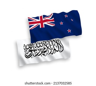 National vector fabric wave flags of New Zealand and Islamic Emirate of Afghanistan isolated on white background. 1 to 2 proportion.
