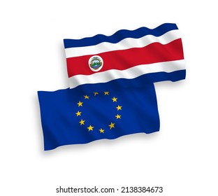 National vector fabric wave flags of European Union and Republic of Costa Rica isolated on white background. 1 to 2 proportion.