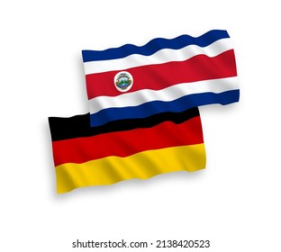 National vector fabric wave flags of Germany and Republic of Costa Rica isolated on white background. 1 to 2 proportion.