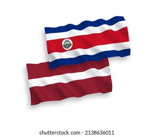 National vector fabric wave flags of Latvia and Republic of Costa Rica isolated on white background. 1 to 2 proportion.
