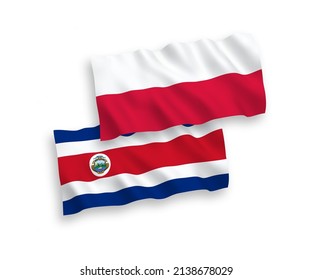 National vector fabric wave flags of Republic of Costa Rica and Poland isolated on white background. 1 to 2 proportion.