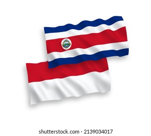 Banderas de olas de tela vectorial nacional de Indonesia y la República de Costa Rica aisladas en fondo blanco. de 1 a 2.