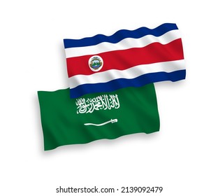 National vector fabric wave flags of Saudi Arabia and Republic of Costa Rica isolated on white background. 1 to 2 proportion.