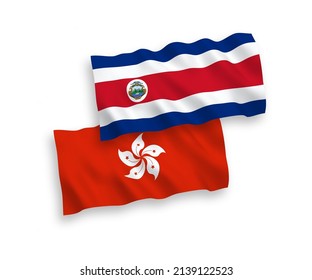 National vector fabric wave flags of Republic of Costa Rica and Hong Kong isolated on white background. 1 to 2 proportion.