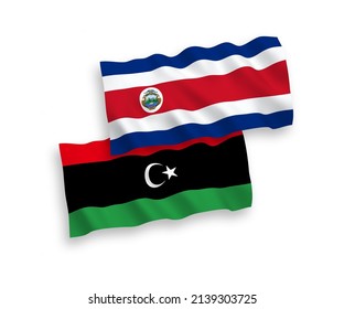 National vector fabric wave flags of Republic of Costa Rica and Libya isolated on white background. 1 to 2 proportion.