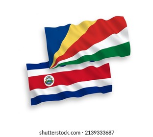 National vector fabric wave flags of Republic of Costa Rica and Seychelles isolated on white background. 1 to 2 proportion.