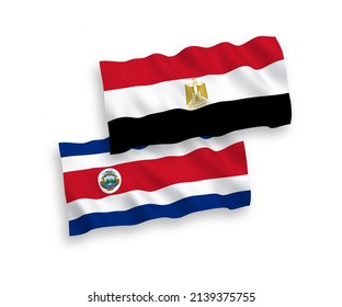 National vector fabric wave flags of Republic of Costa Rica and Egypt isolated on white background. 1 to 2 proportion.