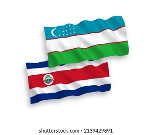 National vector fabric wave flags of Republic of Costa Rica and Uzbekistan isolated on white background. 1 to 2 proportion.