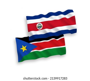 National vector fabric wave flags of Republic of Costa Rica and Republic of South Sudan isolated on white background. 1 to 2 proportion.